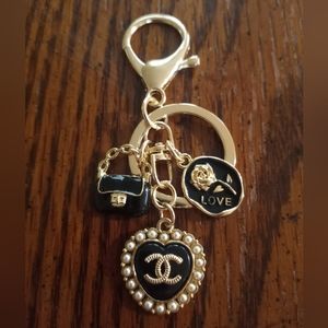 Authentic CHANEL black pearl heart button on an unbranded keychain.  Reposhed